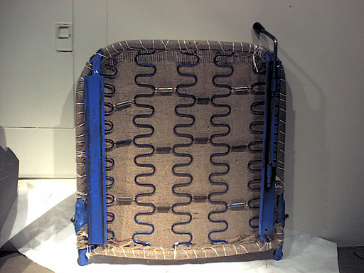 Burlap secured with twine to seat frame - bottom view